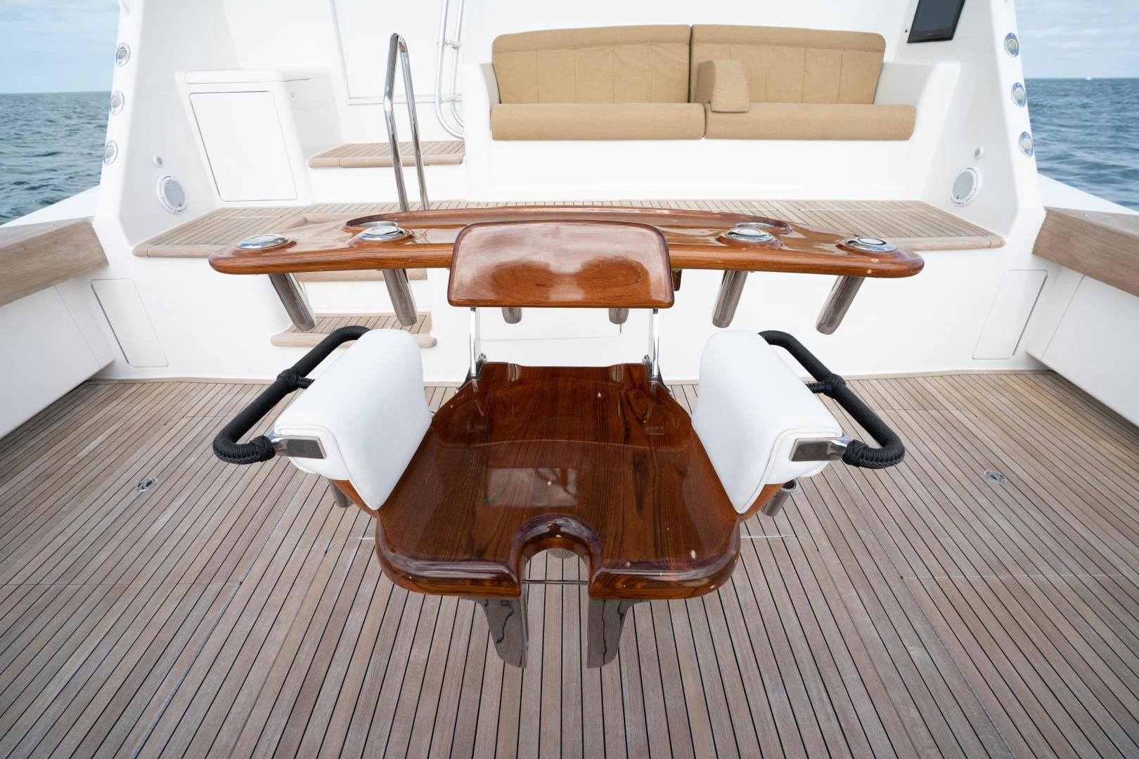 a wooden chair on a deck aboard MER SEA SAKES Yacht for Sale