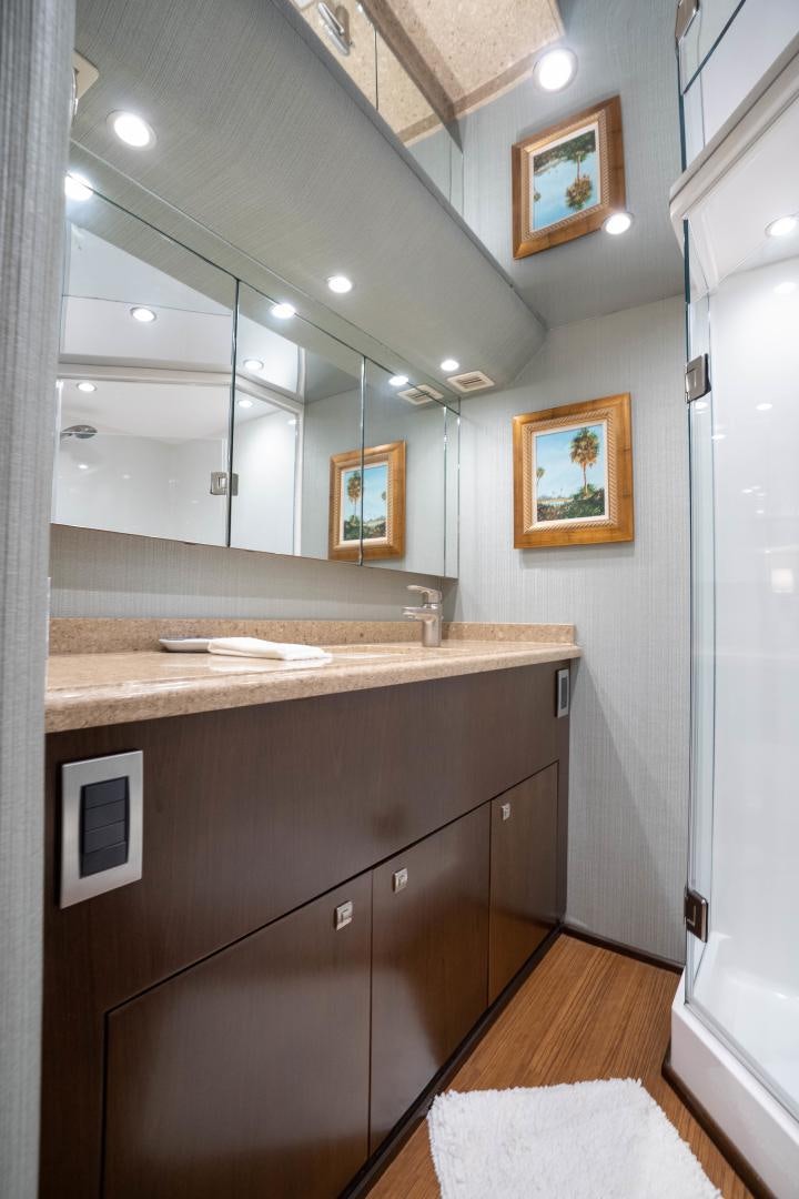 a bathroom with a countertop sink and mirror aboard MER SEA SAKES Yacht for Sale