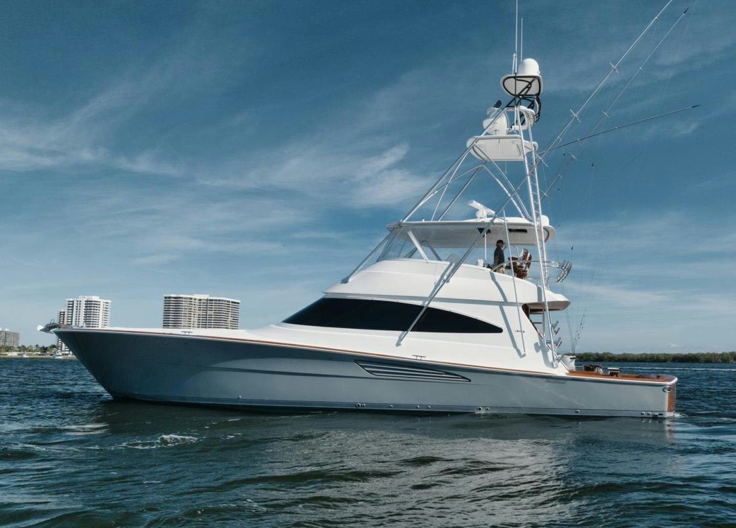 a white boat on the water aboard MADNIC Yacht for Sale