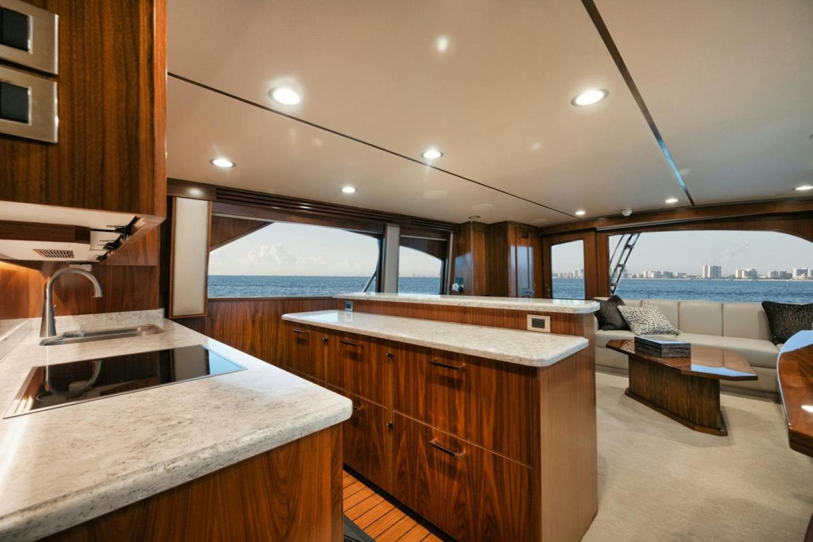 a kitchen with a large island aboard MADNIC Yacht for Sale