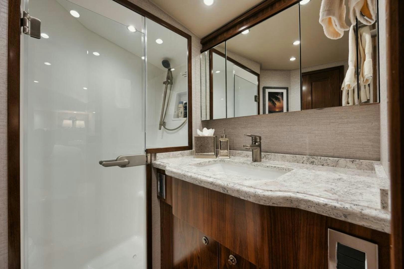 a bathroom with a large mirror aboard MADNIC Yacht for Sale
