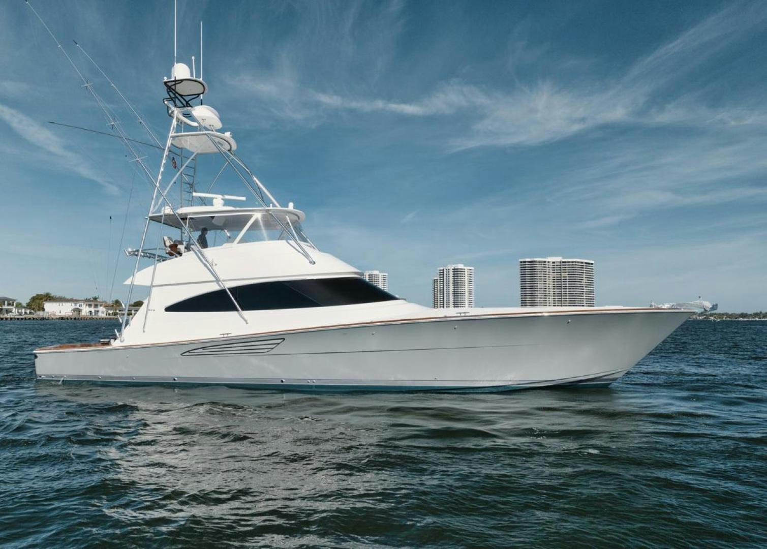 a white boat in the water aboard MADNIC Yacht for Sale