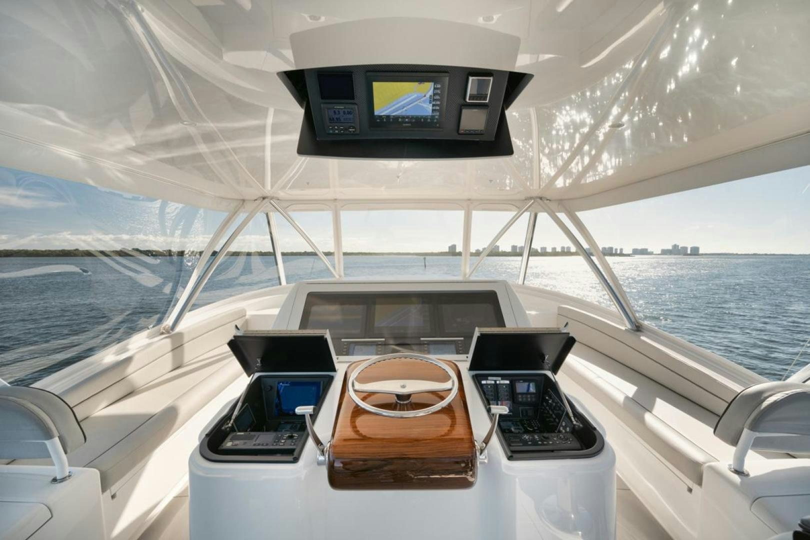 a boat with a screen on the back aboard MADNIC Yacht for Sale