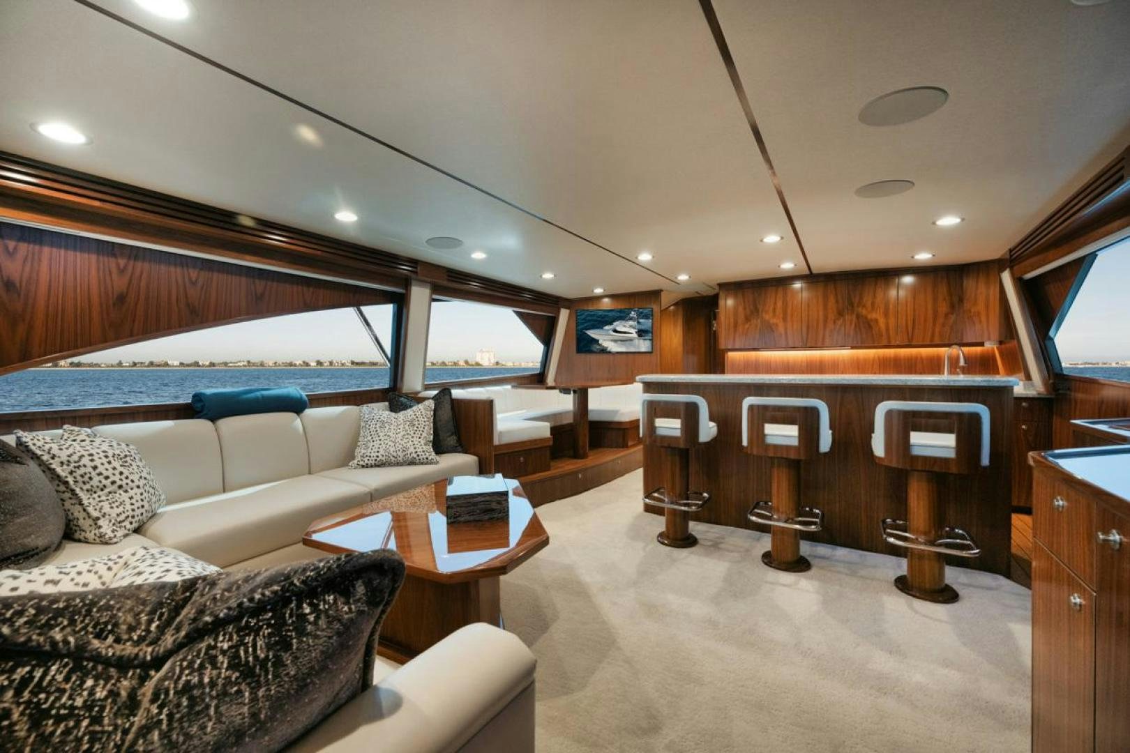 a living room with a large bed aboard MADNIC Yacht for Sale