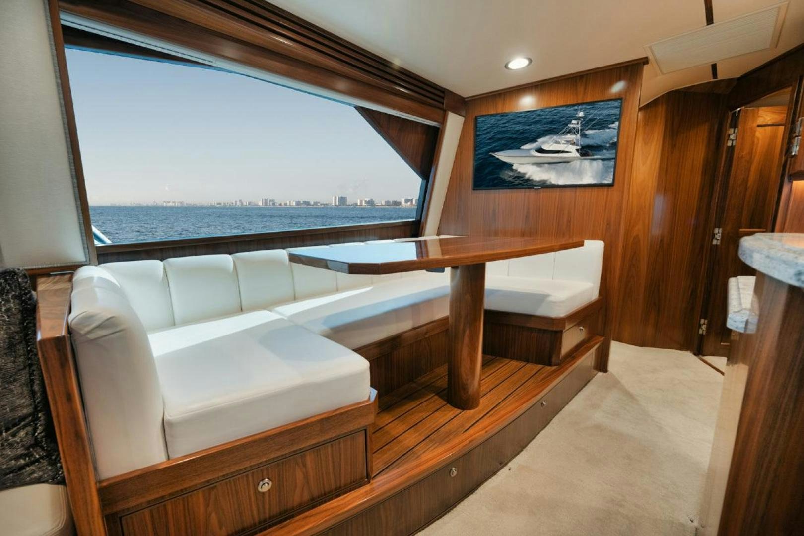 a room with a couch and a table aboard MADNIC Yacht for Sale