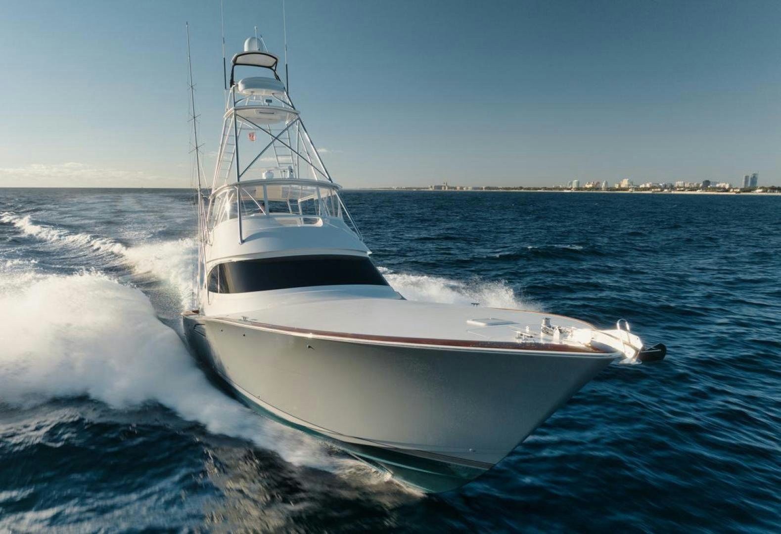 a white boat on the water aboard MADNIC Yacht for Sale