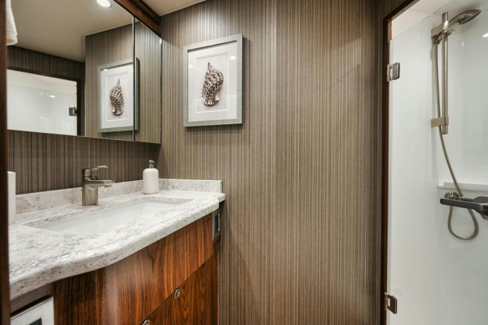 a bathroom with a sink and a mirror aboard MADNIC Yacht for Sale