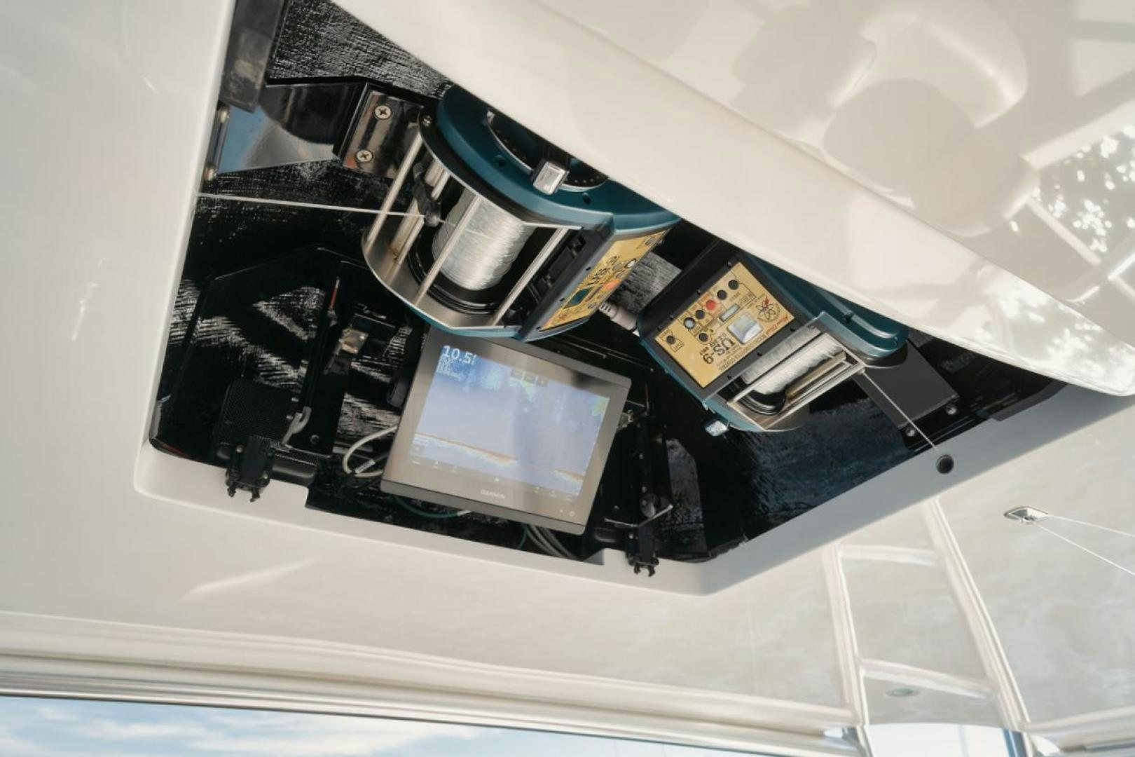 a computer on a table aboard MADNIC Yacht for Sale