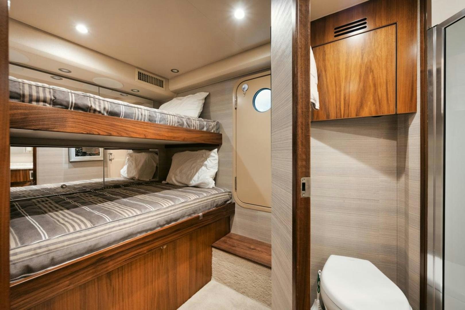 a bedroom with a bunk bed aboard MADNIC Yacht for Sale