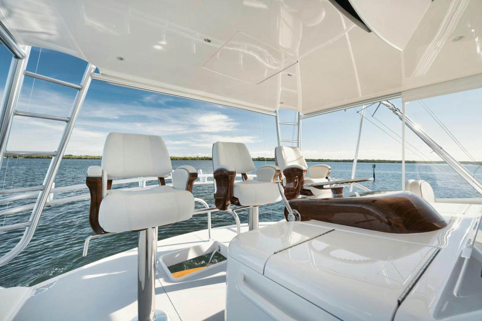 a group of people sitting on a boat aboard MADNIC Yacht for Sale