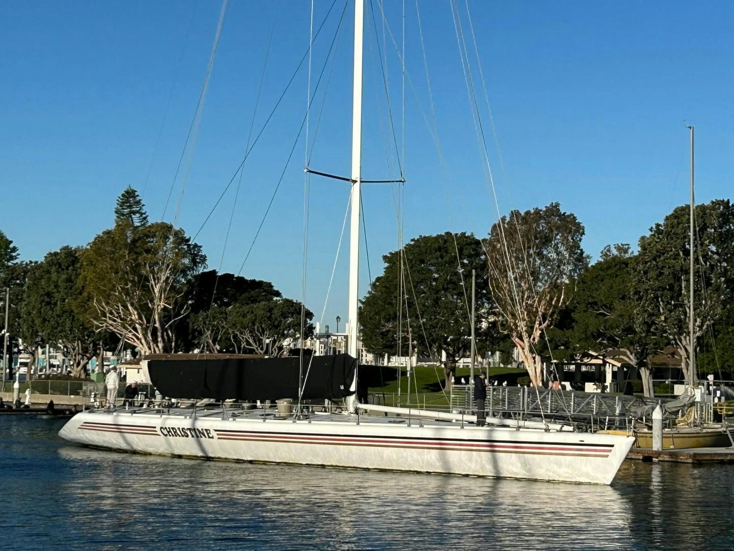 a boat is parked in a harbor aboard CHRISTINE Yacht for Sale