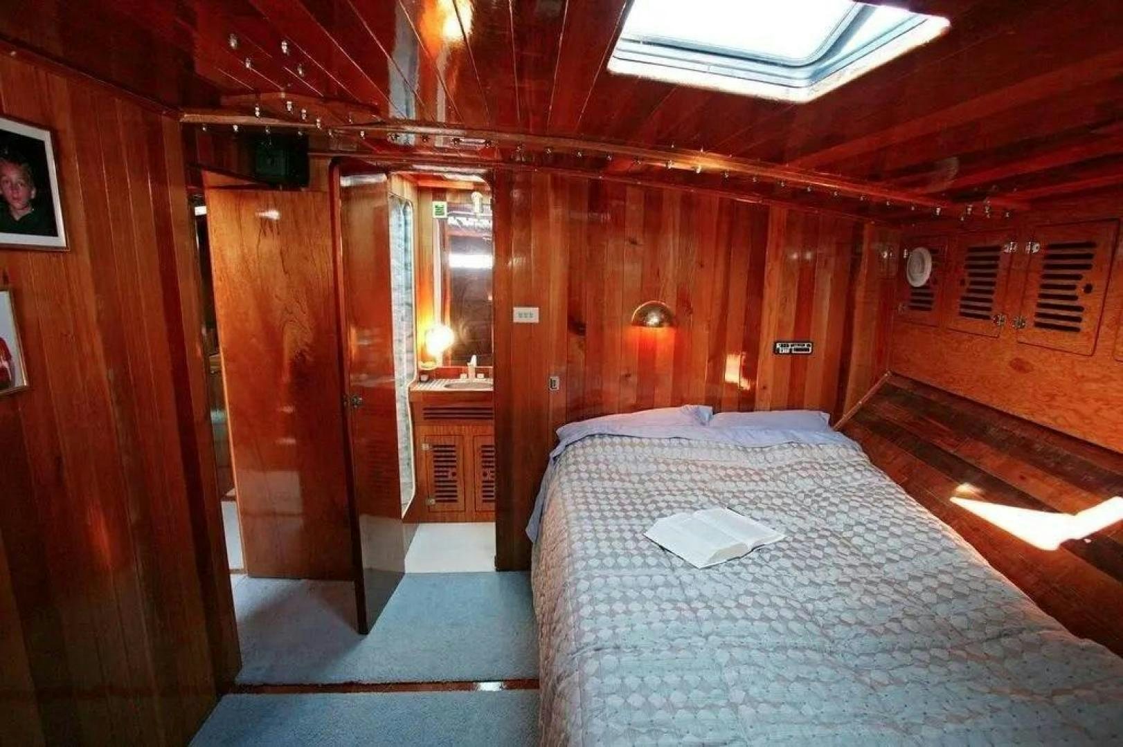 a bed in a cabin aboard CHRISTINE Yacht for Sale