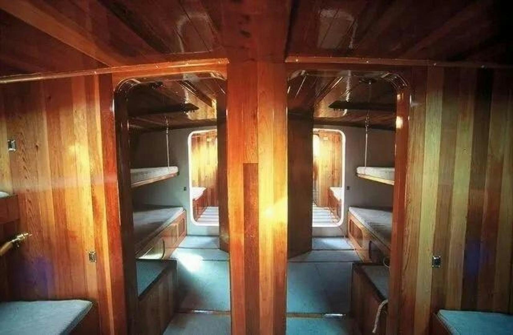 a room with wood walls and wood floors aboard CHRISTINE Yacht for Sale