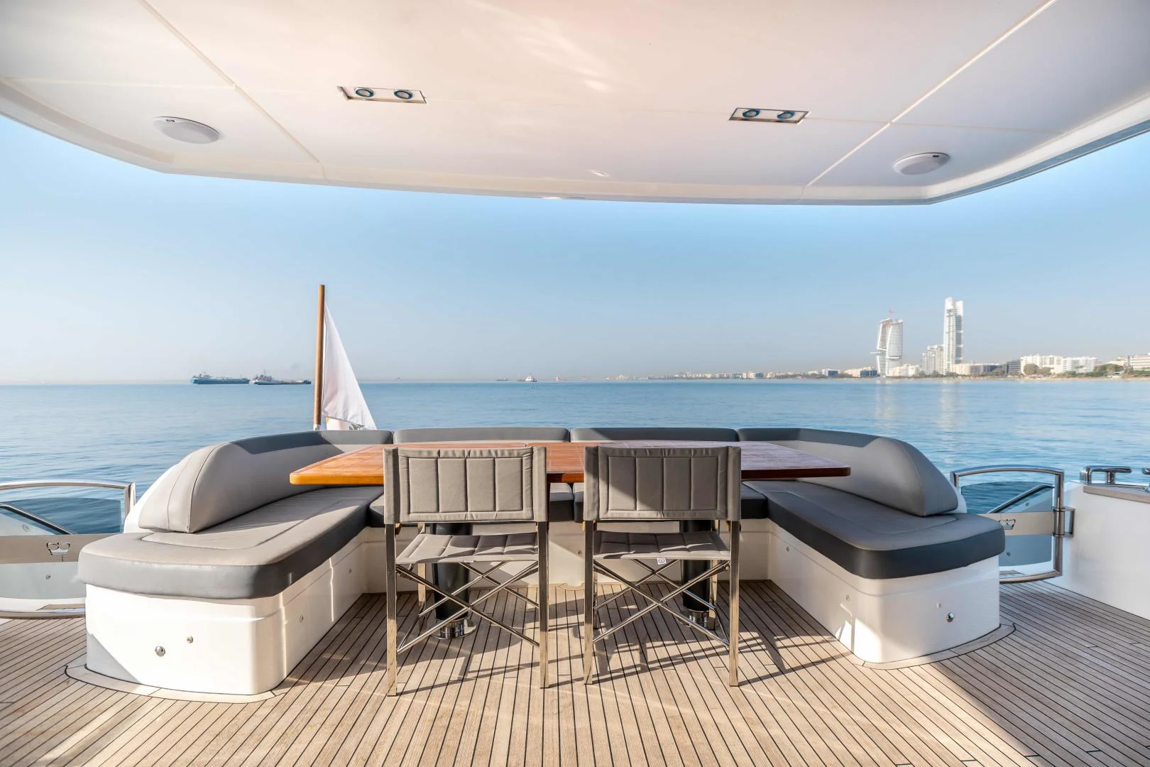 a table and chairs on a deck aboard CAPE COD Yacht for Sale
