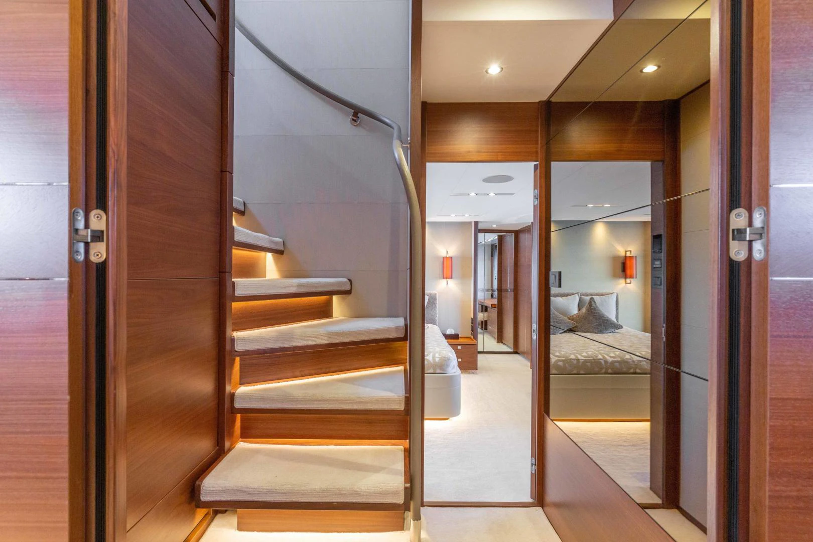 a set of doors leading to a room with a bed and a bench aboard CAPE COD Yacht for Sale