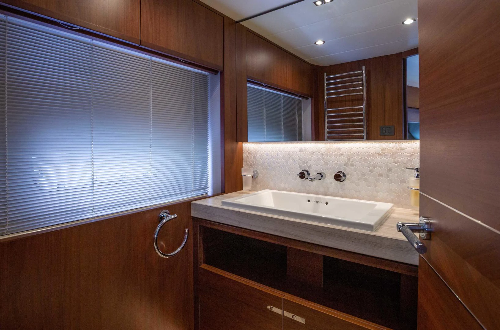 a bathroom with a sink and a mirror aboard CAPE COD Yacht for Sale