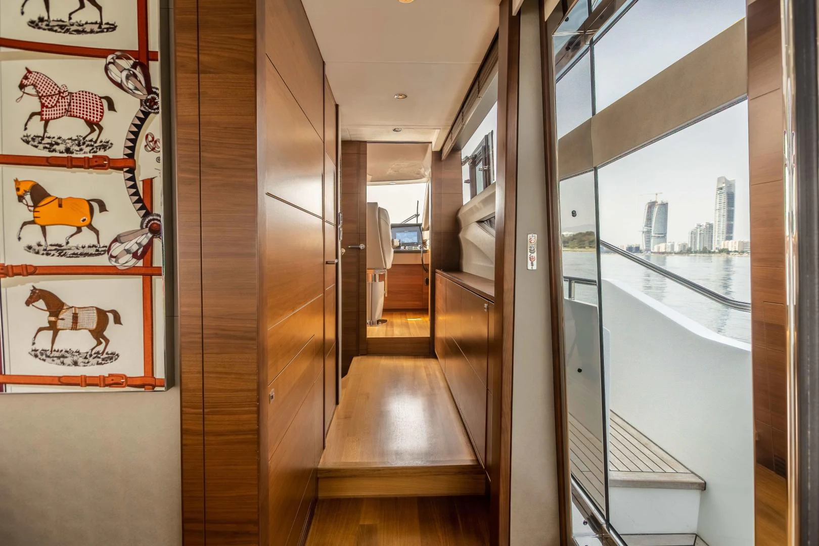 a room with a wood floor and a wood floor with a large window aboard CAPE COD Yacht for Sale