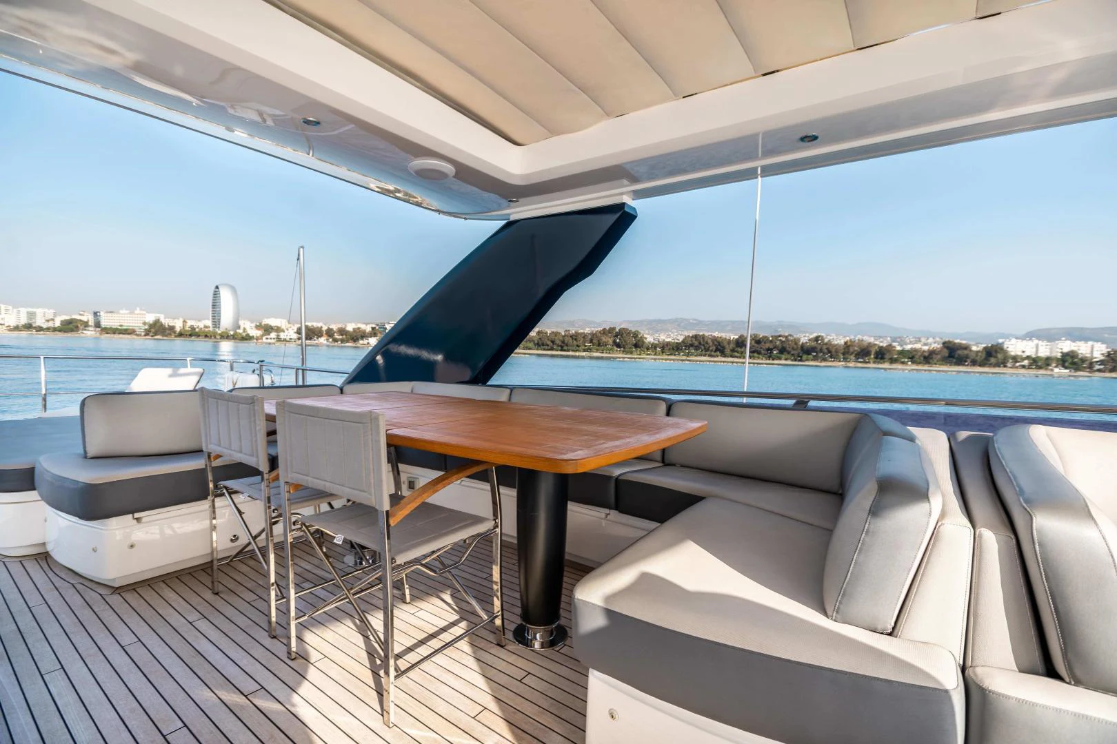 a table and chairs on a deck aboard CAPE COD Yacht for Sale