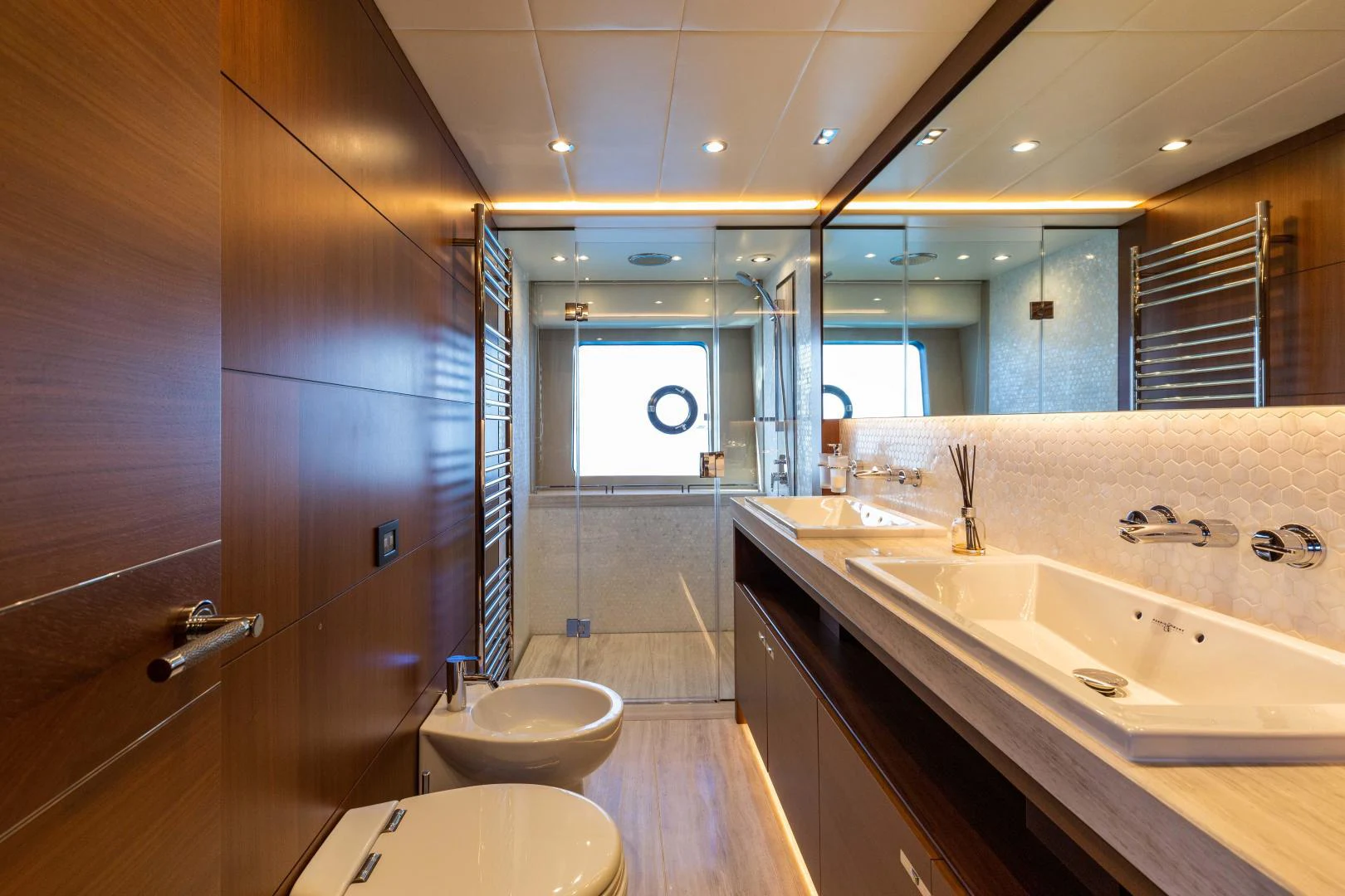 a bathroom with a large mirror aboard CAPE COD Yacht for Sale