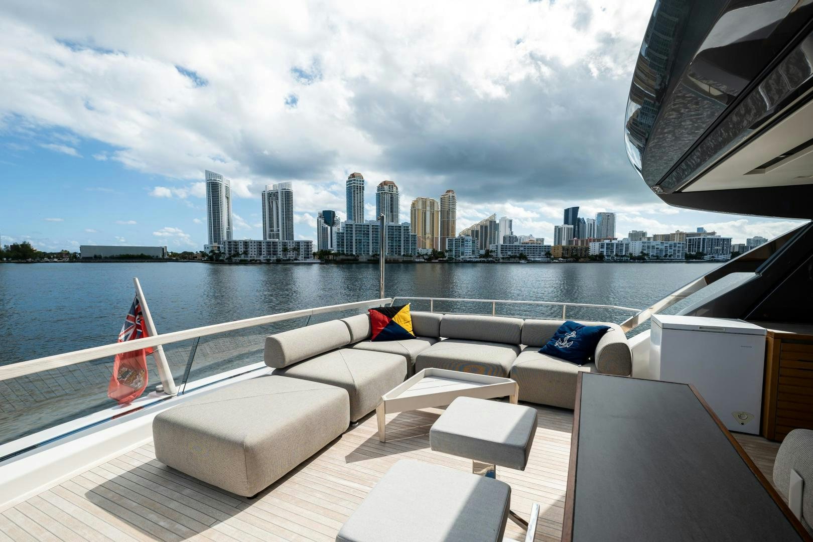 a deck with a view of a city and a body of water aboard ABOUT TIME Yacht for Sale