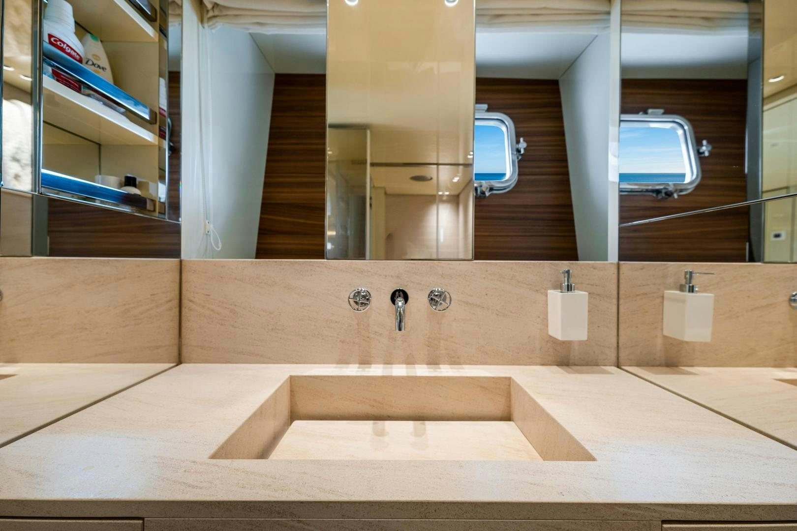 a bathroom with a large mirror aboard ABOUT TIME Yacht for Sale