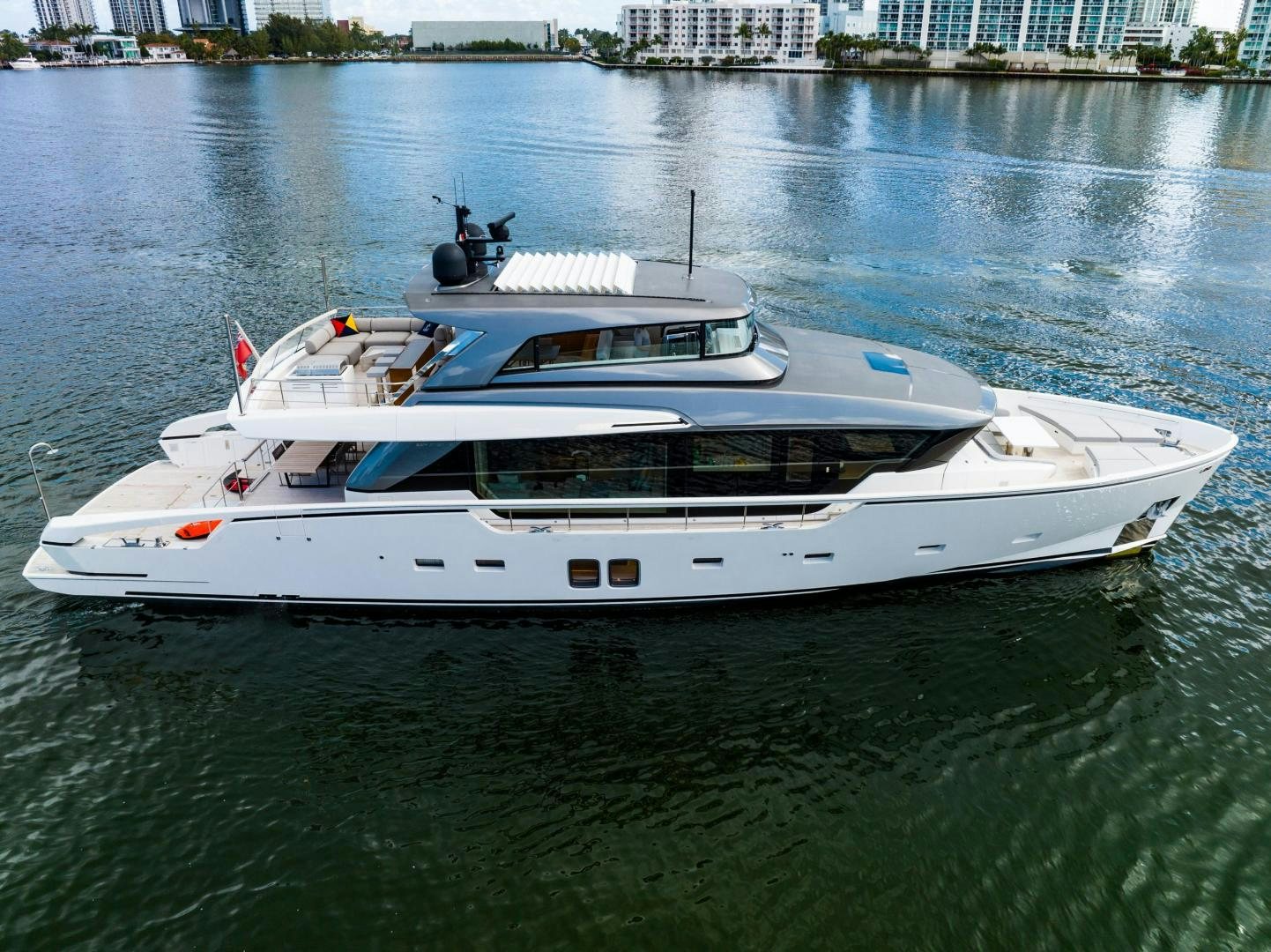 a white yacht on the water aboard ABOUT TIME Yacht for Sale
