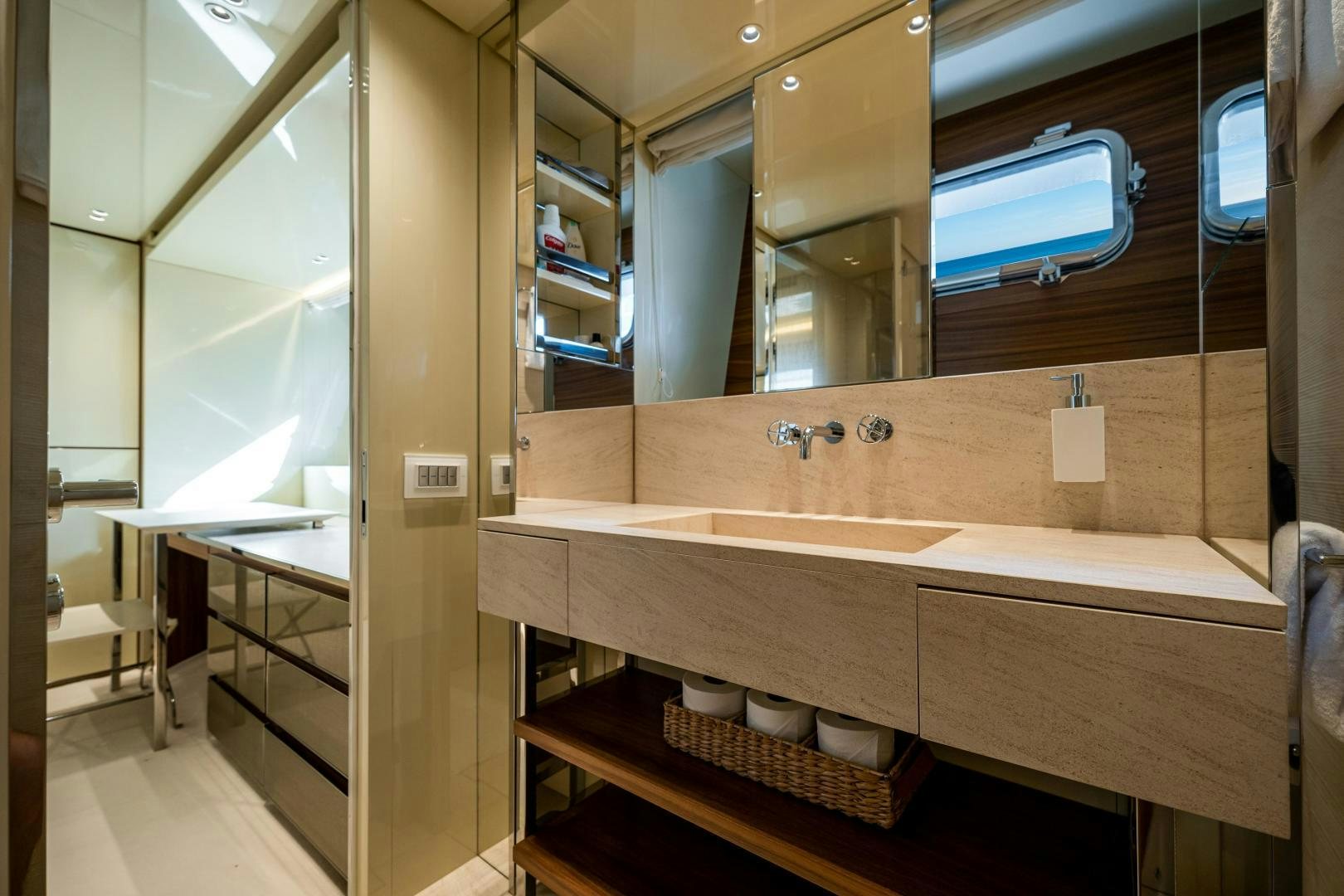 a bathroom with a large mirror aboard ABOUT TIME Yacht for Sale