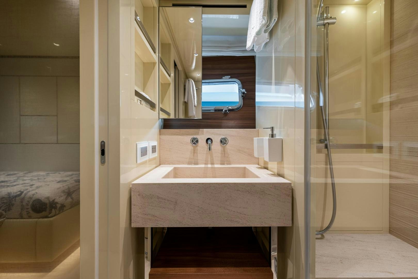 a bathroom with a sink and shower aboard ABOUT TIME Yacht for Sale