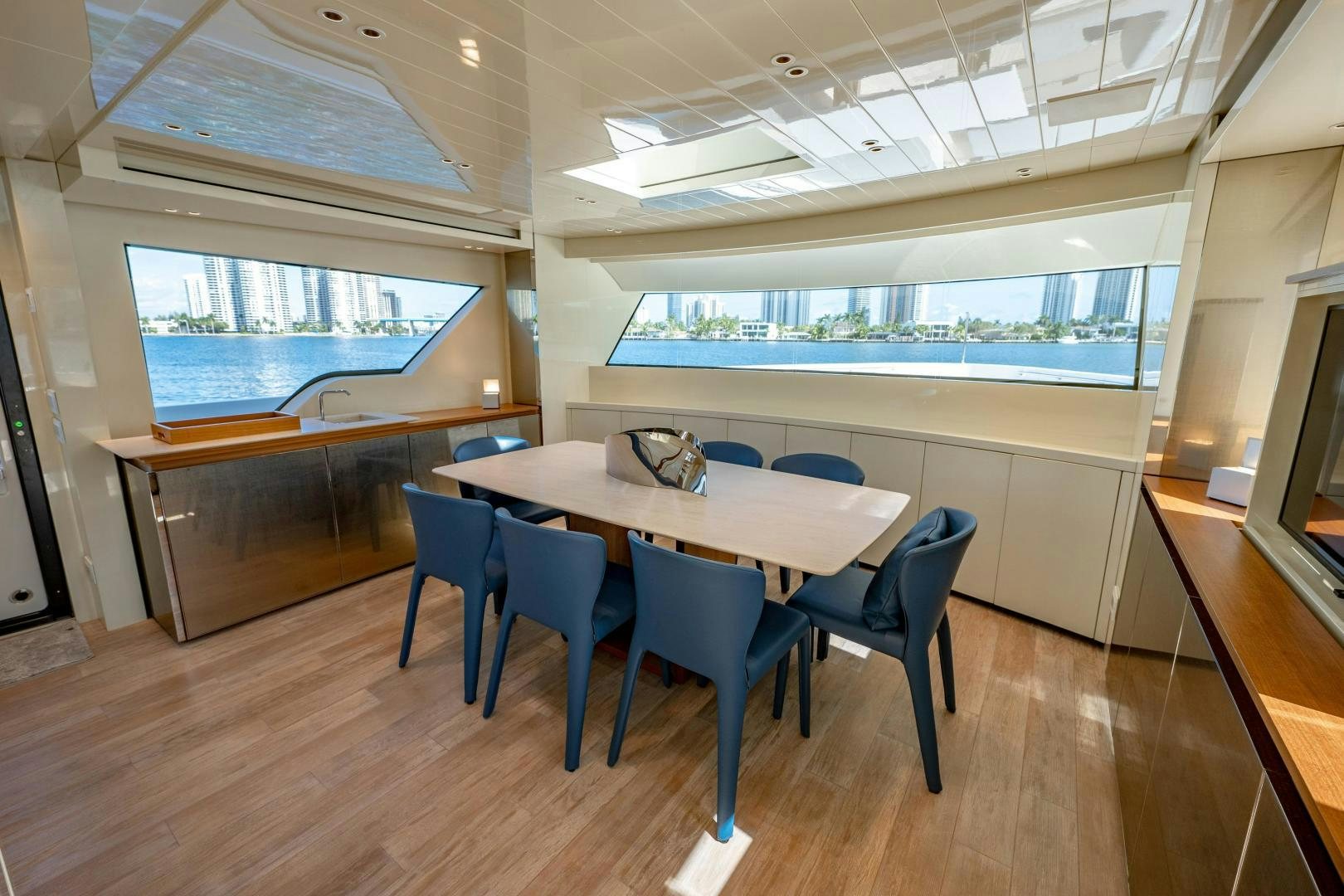 a room with a table and chairs aboard ABOUT TIME Yacht for Sale