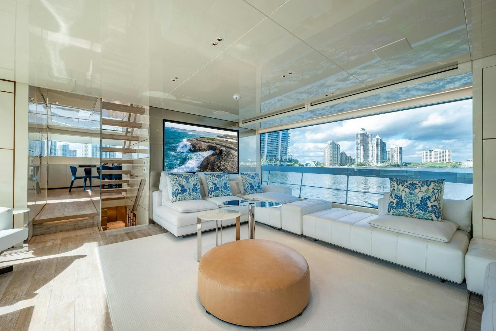 a living room with a large window aboard ABOUT TIME Yacht for Sale