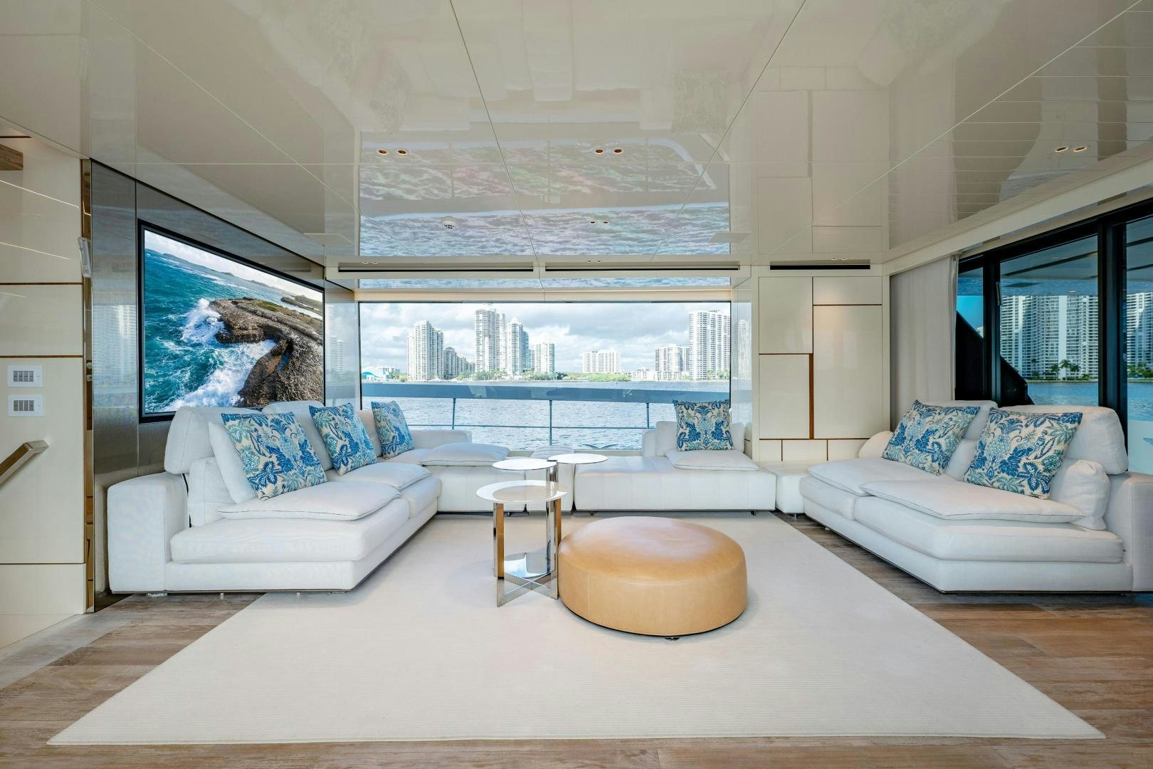 a large living room with a large window aboard ABOUT TIME Yacht for Sale