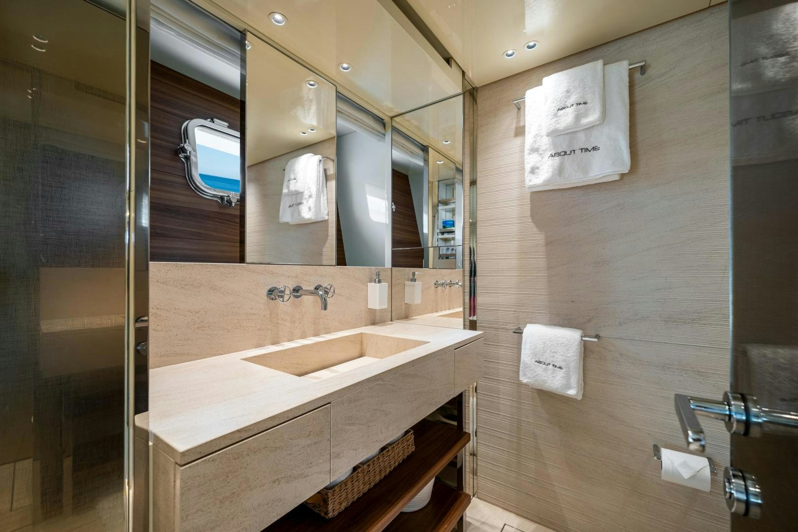a bathroom with a sink and mirror aboard ABOUT TIME Yacht for Sale