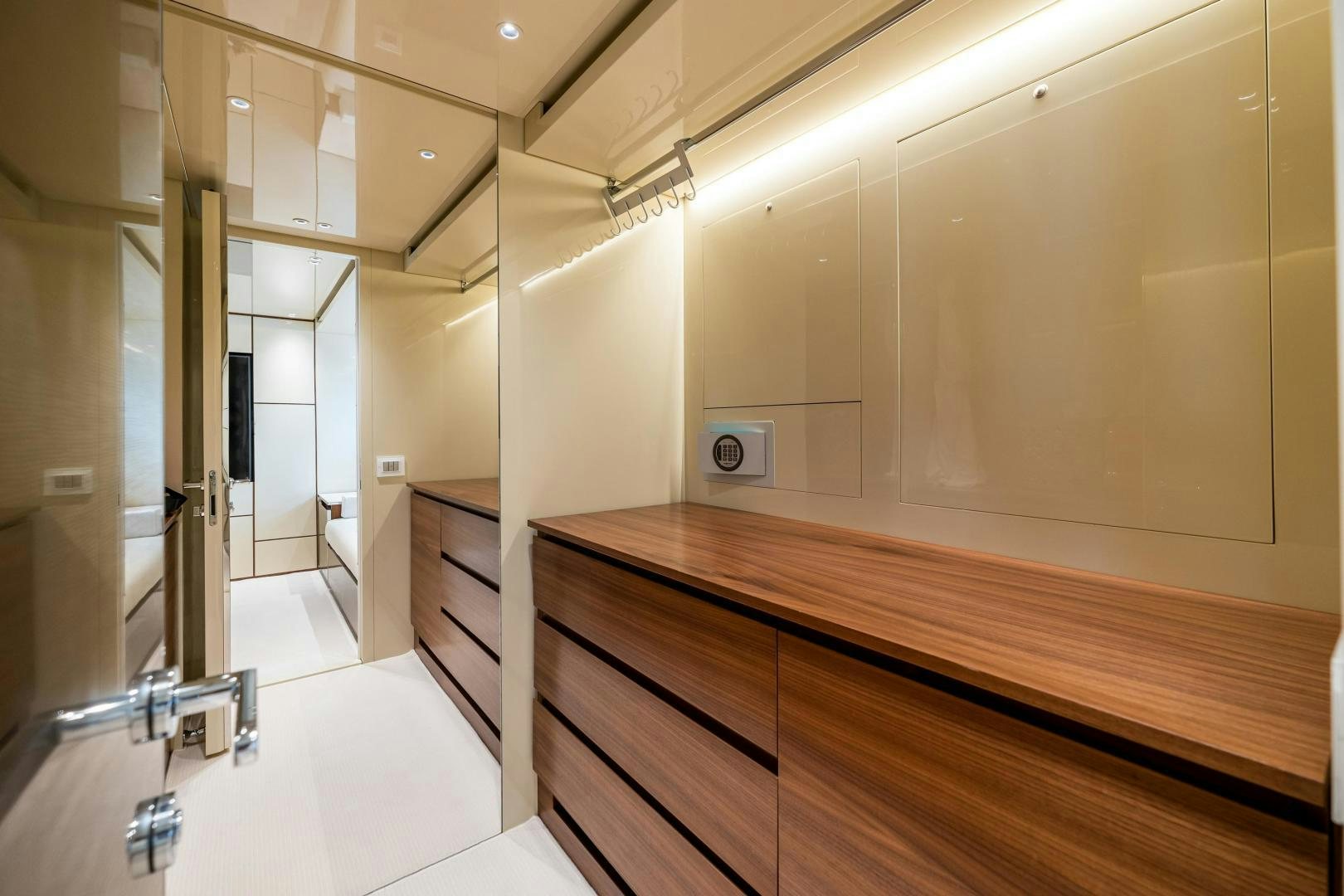 a long hallway with a wood railing aboard ABOUT TIME Yacht for Sale