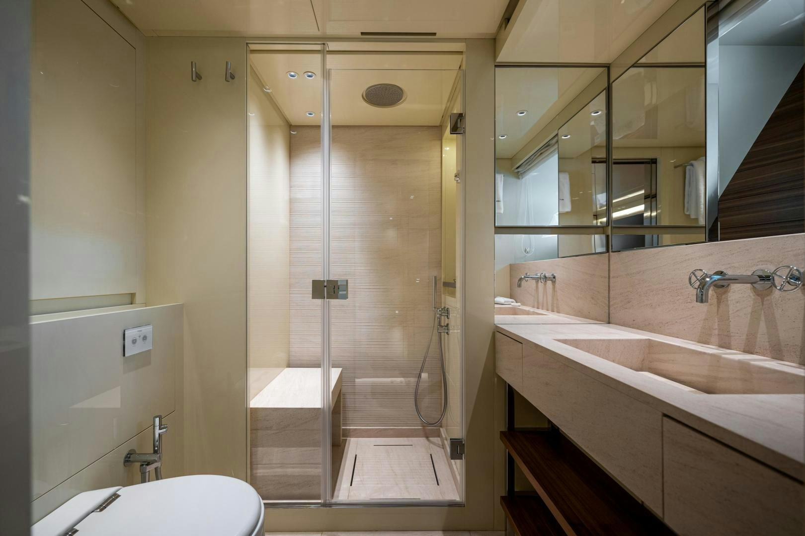 a bathroom with a tub and shower aboard ABOUT TIME Yacht for Sale