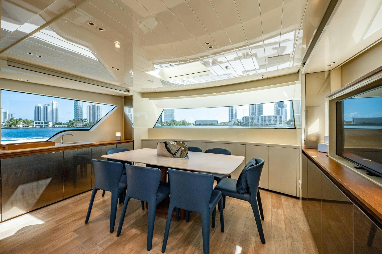 a room with a table and chairs aboard ABOUT TIME Yacht for Sale