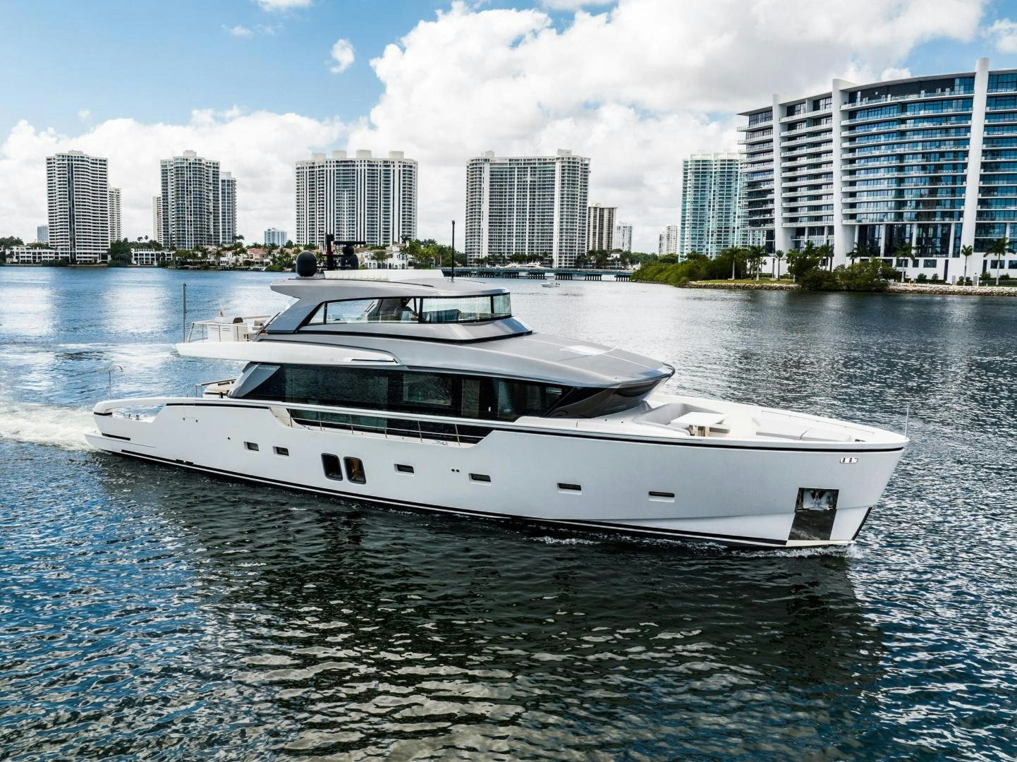 a white yacht on the water aboard ABOUT TIME Yacht for Sale