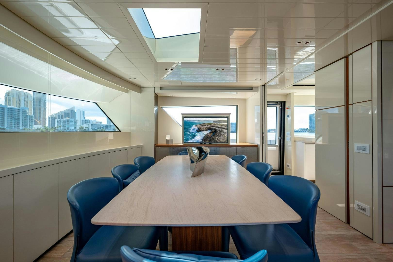 a room with a table and chairs aboard ABOUT TIME Yacht for Sale