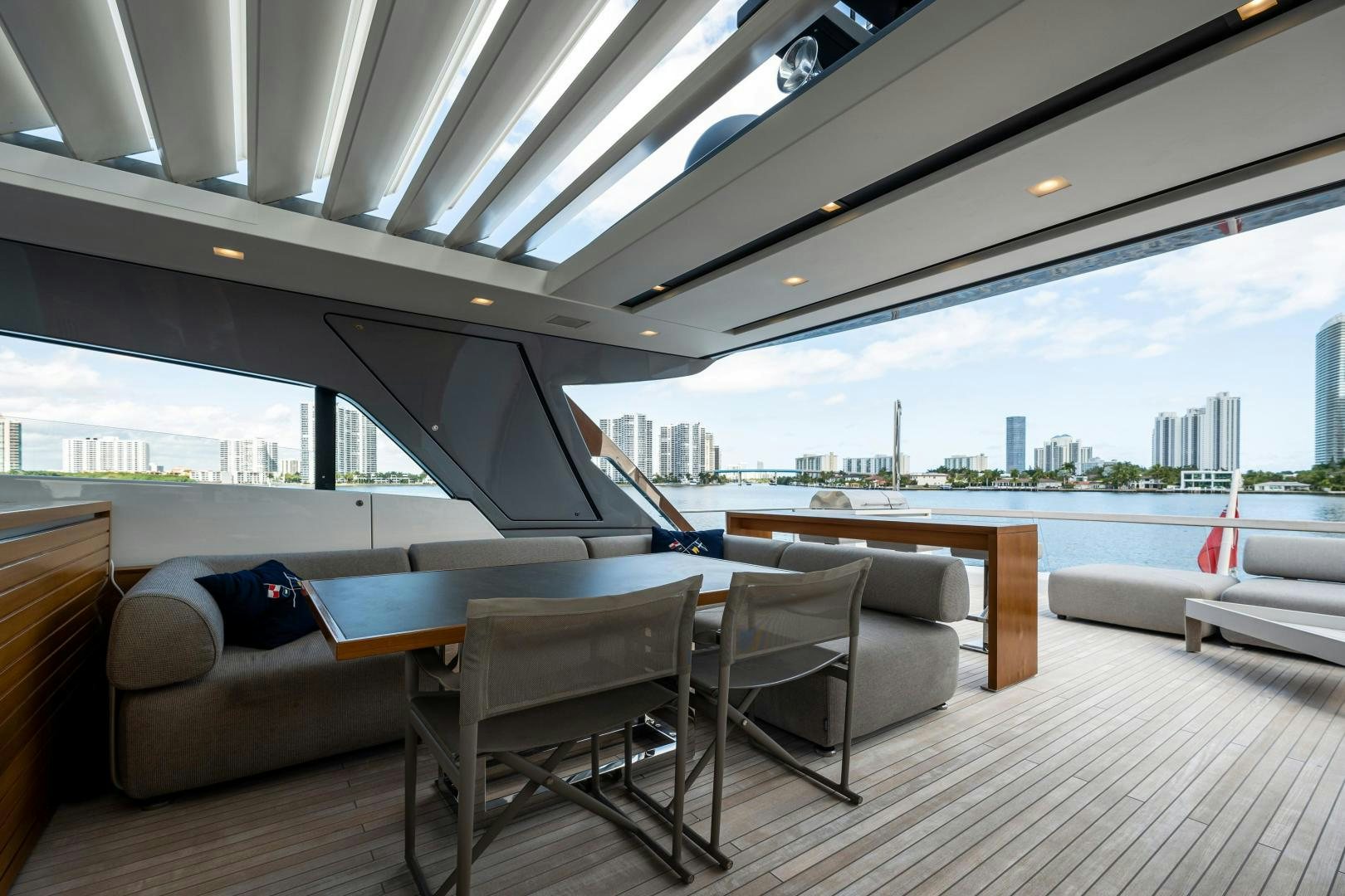 a room with a couch and a table and chairs aboard ABOUT TIME Yacht for Sale