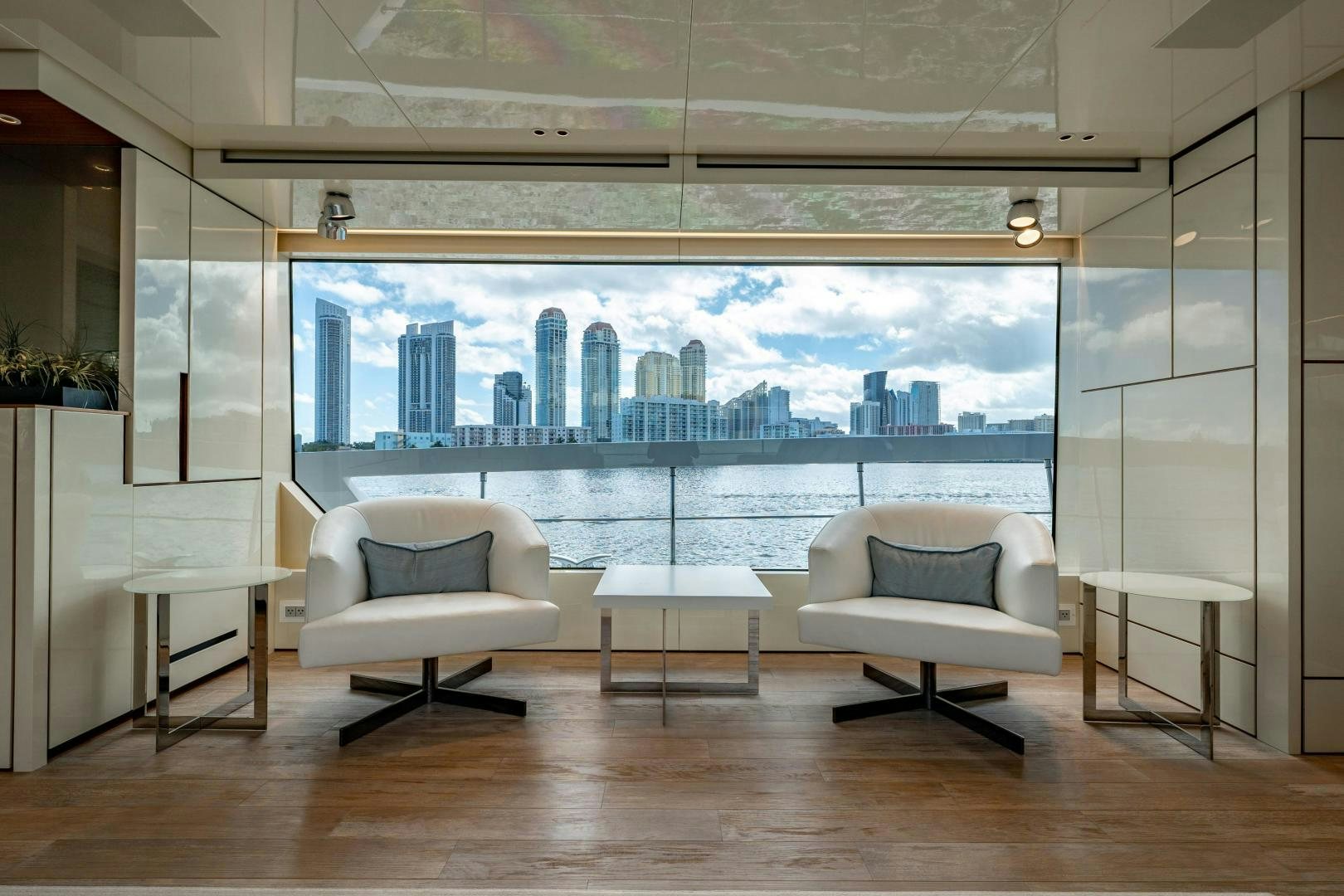 a room with a view of a city aboard ABOUT TIME Yacht for Sale