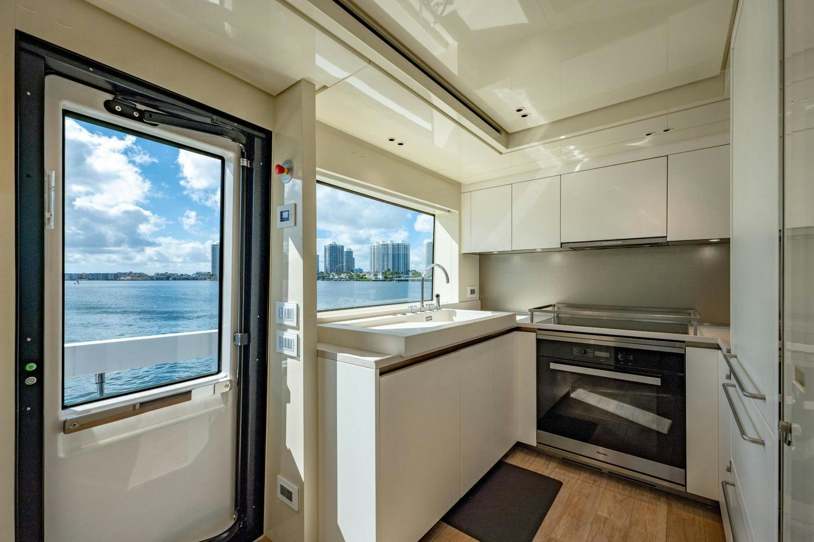 a kitchen with a sliding glass door aboard ABOUT TIME Yacht for Sale