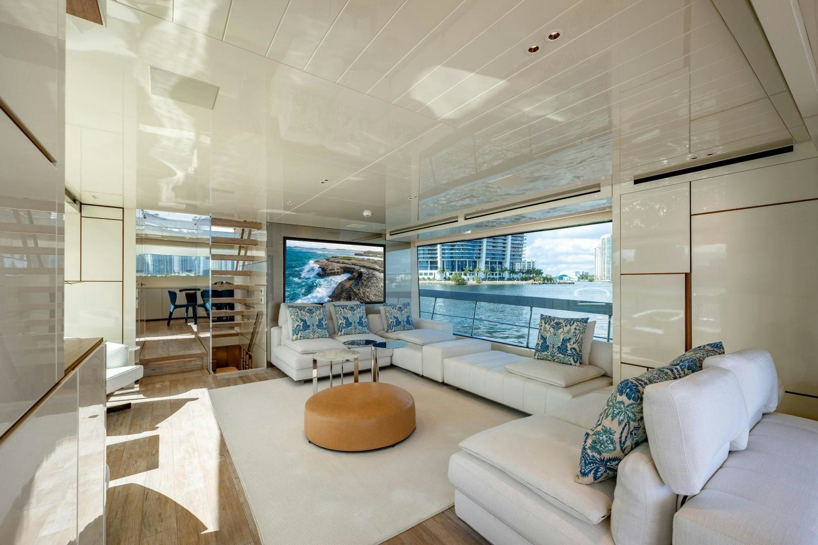 a living room with a large window aboard ABOUT TIME Yacht for Sale