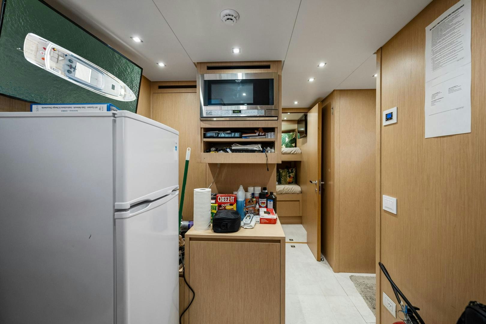 a kitchen with a microwave oven aboard ABOUT TIME Yacht for Sale