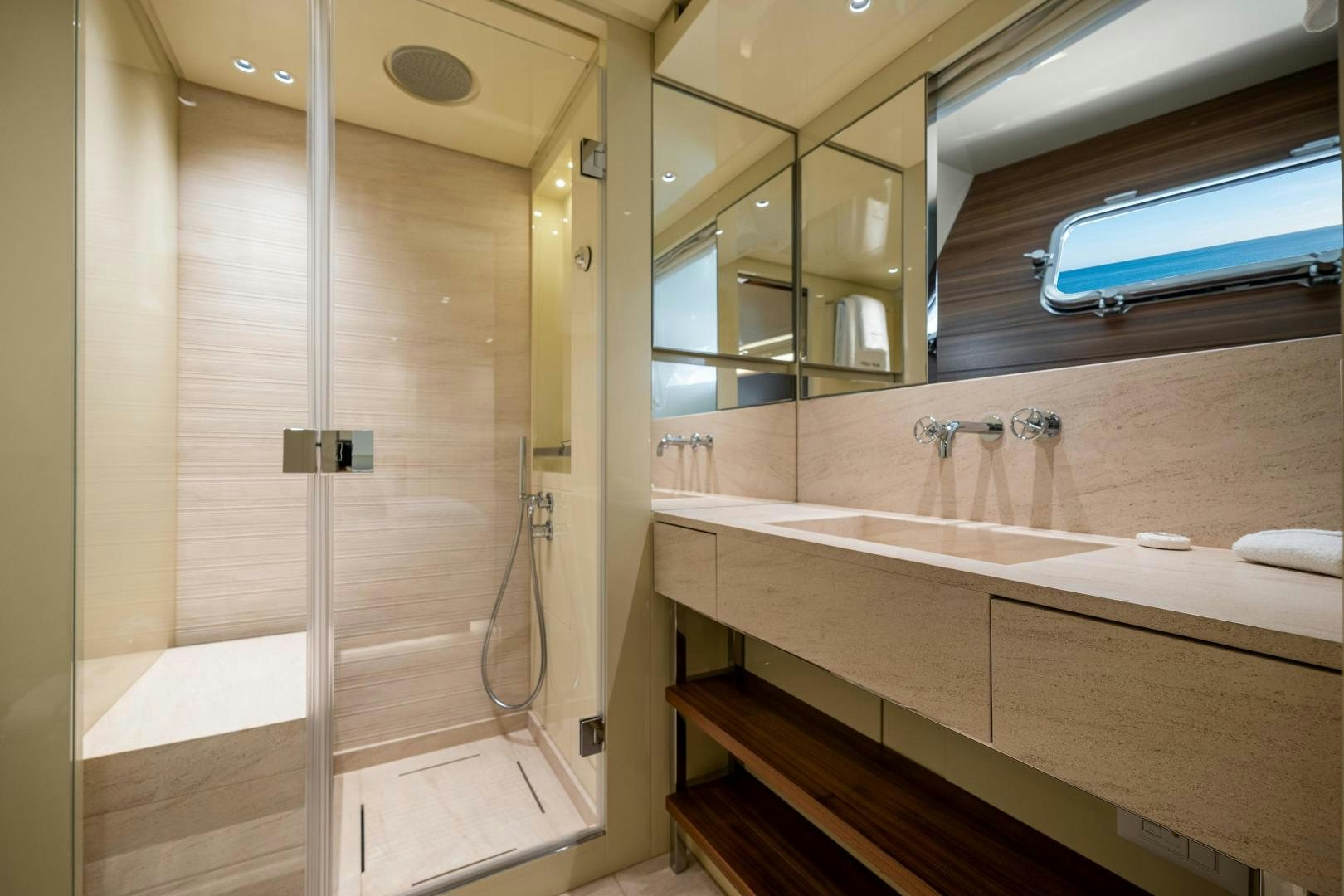 a bathroom with a glass shower aboard ABOUT TIME Yacht for Sale