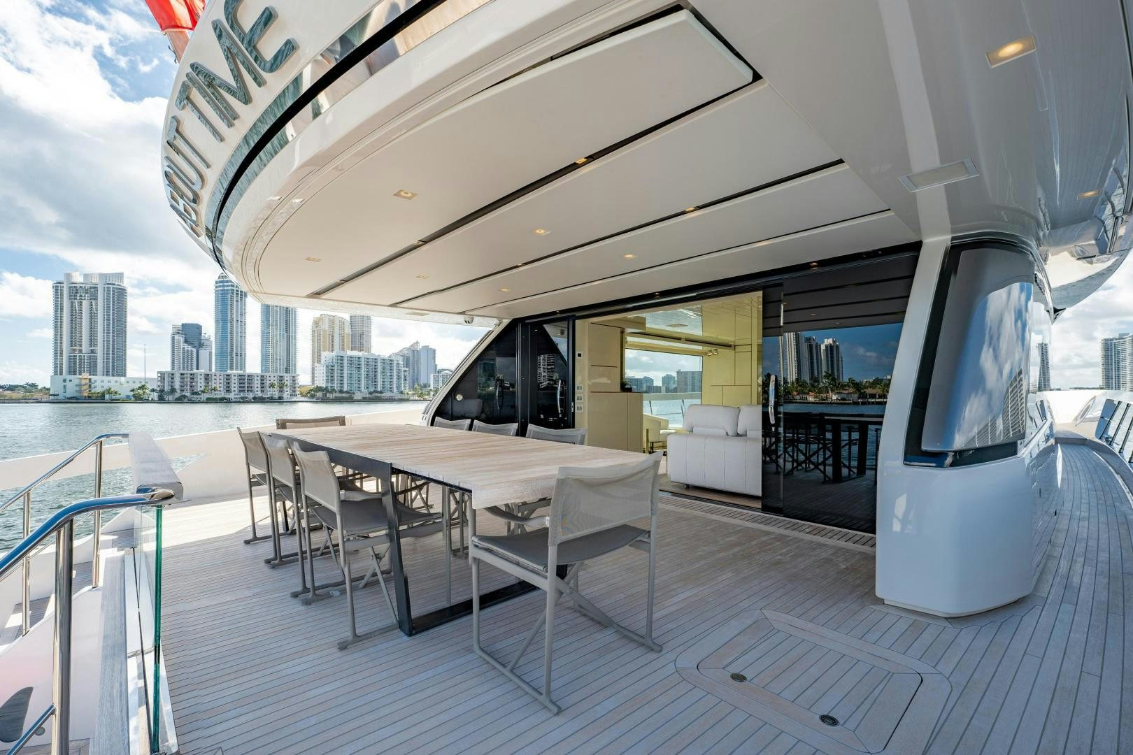 a table and chairs on a deck aboard ABOUT TIME Yacht for Sale