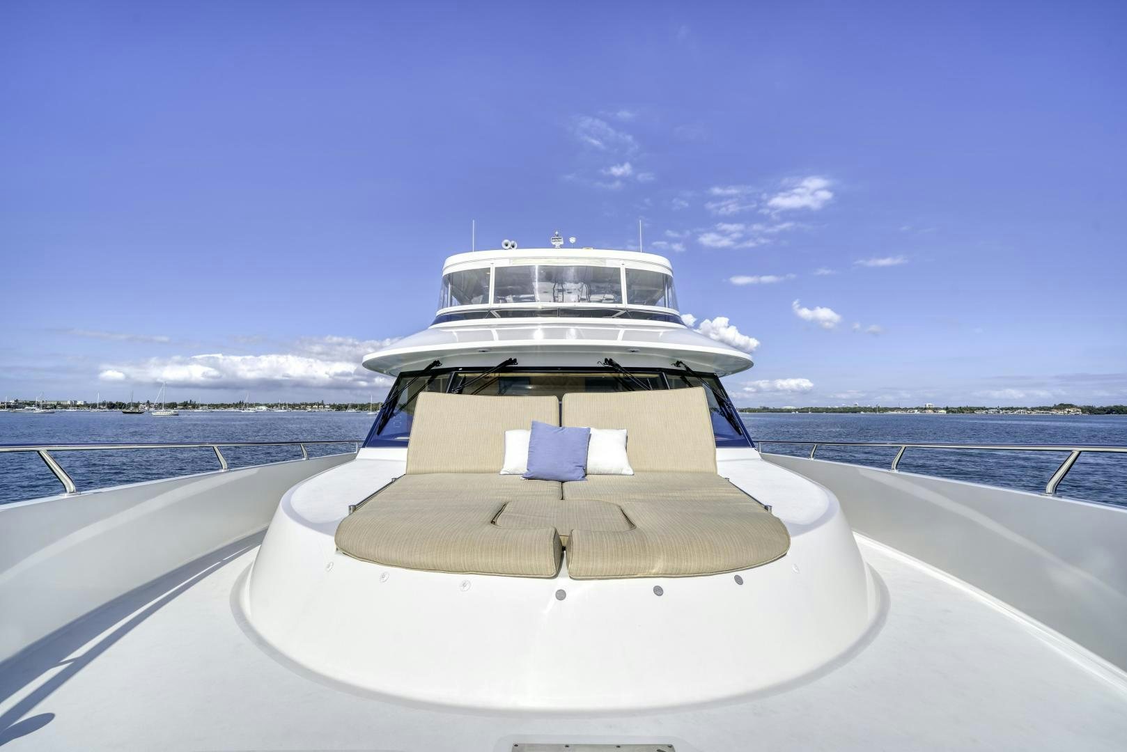 a white boat on a beach aboard SANCTUARY Yacht for Sale