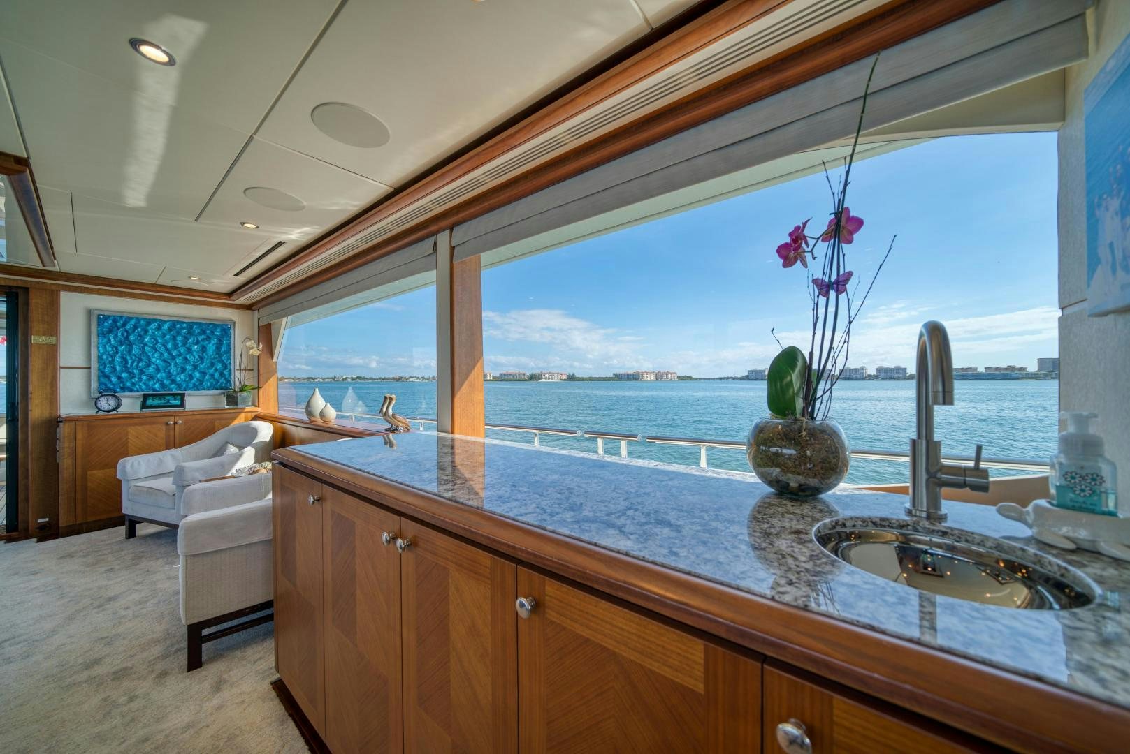 a large kitchen with a large window aboard SANCTUARY Yacht for Sale