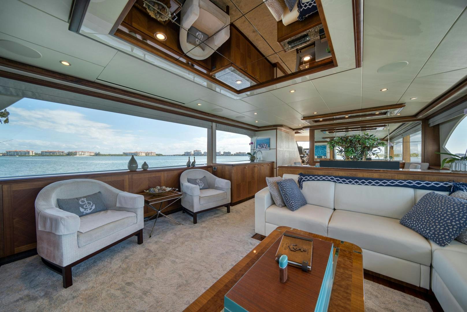 a living room with a large open window aboard SANCTUARY Yacht for Sale