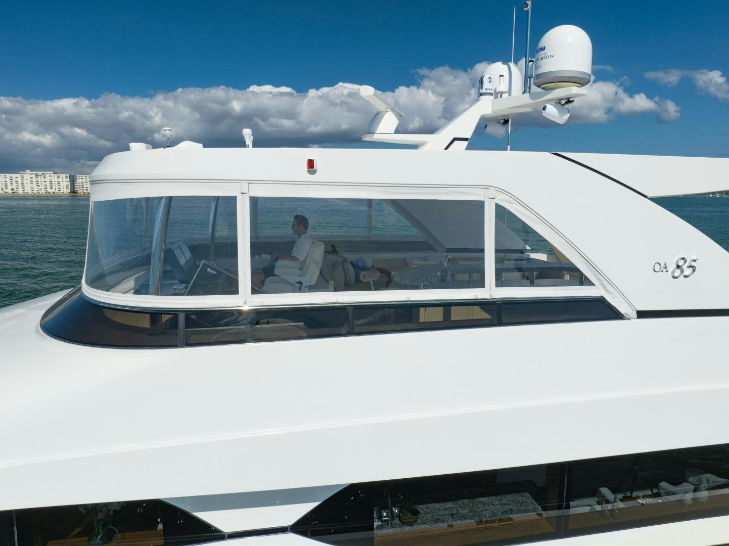 a person driving a white boat aboard SANCTUARY Yacht for Sale