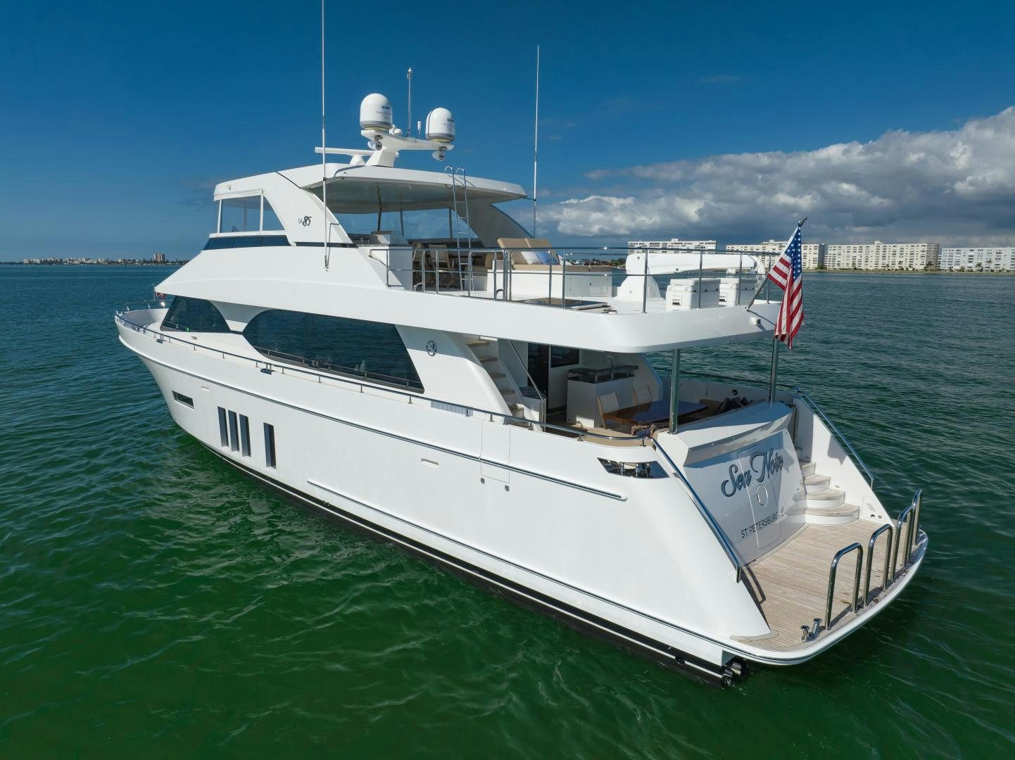 a large white boat in the water aboard SANCTUARY Yacht for Sale
