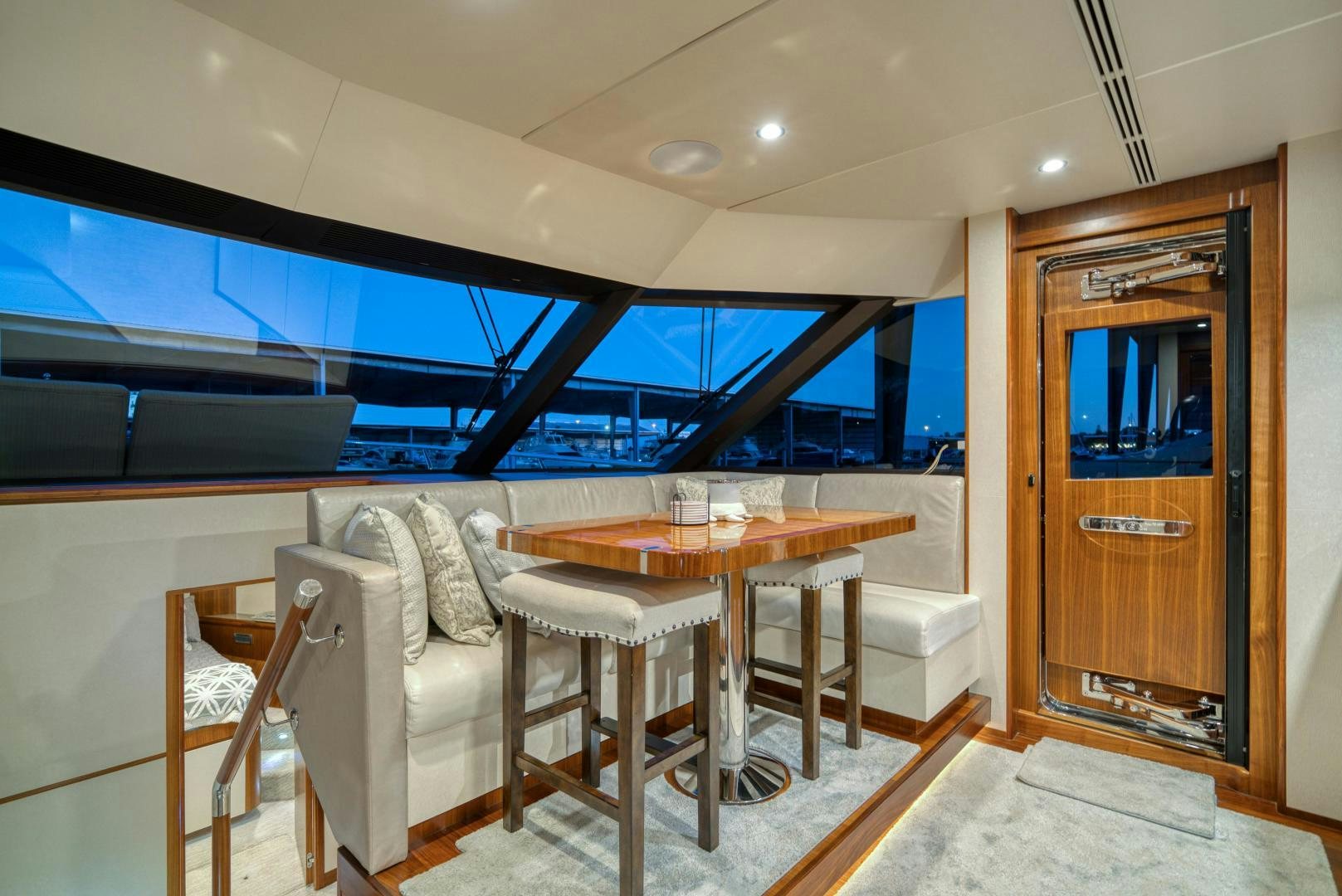 a room with a table and chairs aboard SANCTUARY Yacht for Sale